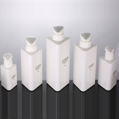 La forma al por mayor del triángulo de 100ml 200ml 300ml recicla las botellas privadas de aire del champú de la bomba 500ml del animal doméstico de la loción del negro plástico del envase