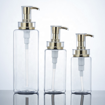 Botella clara del champú del plástico de la loción de 300ml 400ml 500ml del hotel de los hombres vacíos de lujo del acondicionador Packaging16oz con la bomba del oro